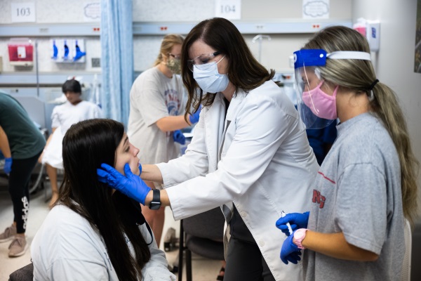 Instructor and student in nursing arts lab